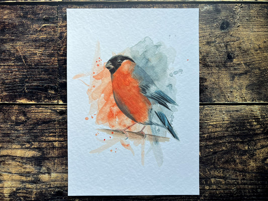 An A4 print of a bullfinch on textured archival paper.