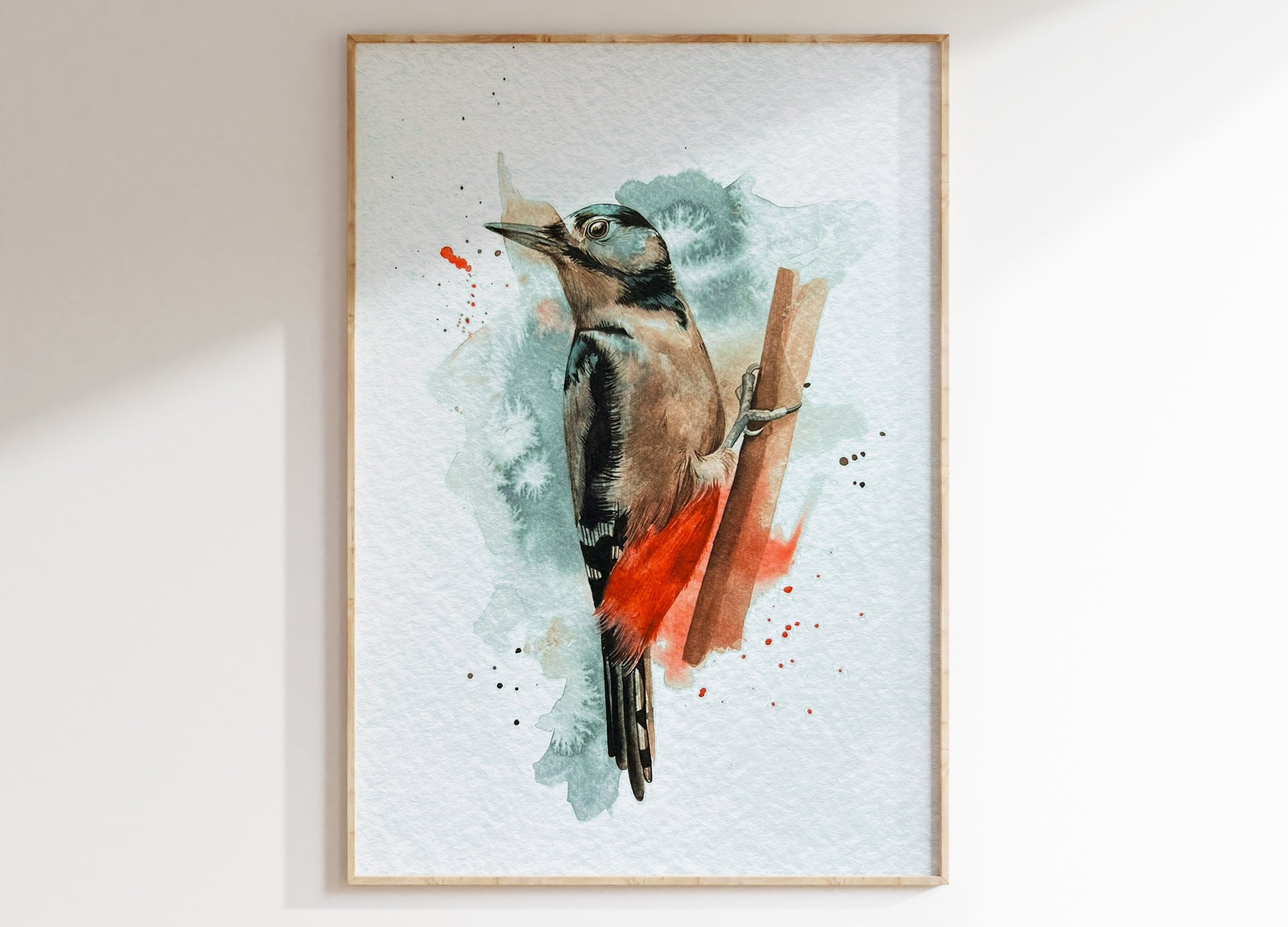 An A4 print of a great spotted woodpecker on textured archival paper.