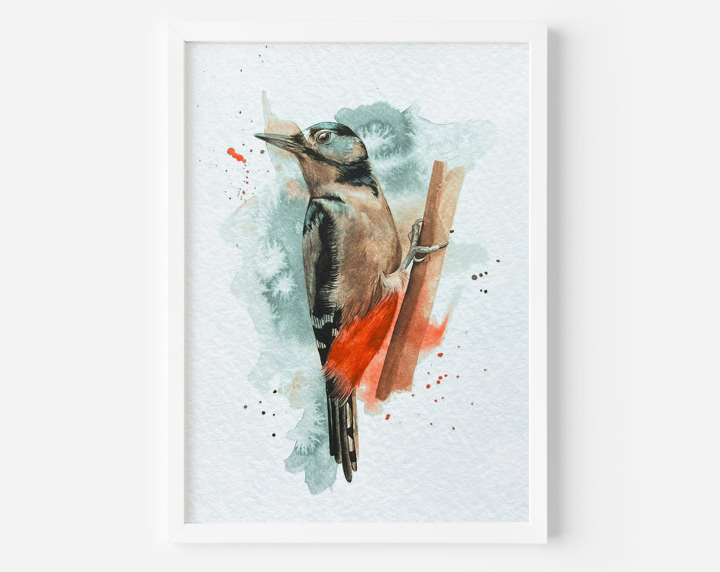 An A4 print of a great spotted woodpecker on textured archival paper.