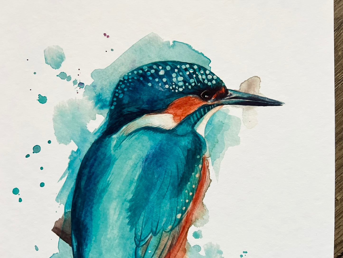 A close up of a watercolour print of an expressively painted kingfisher from forest farm in Cardiff