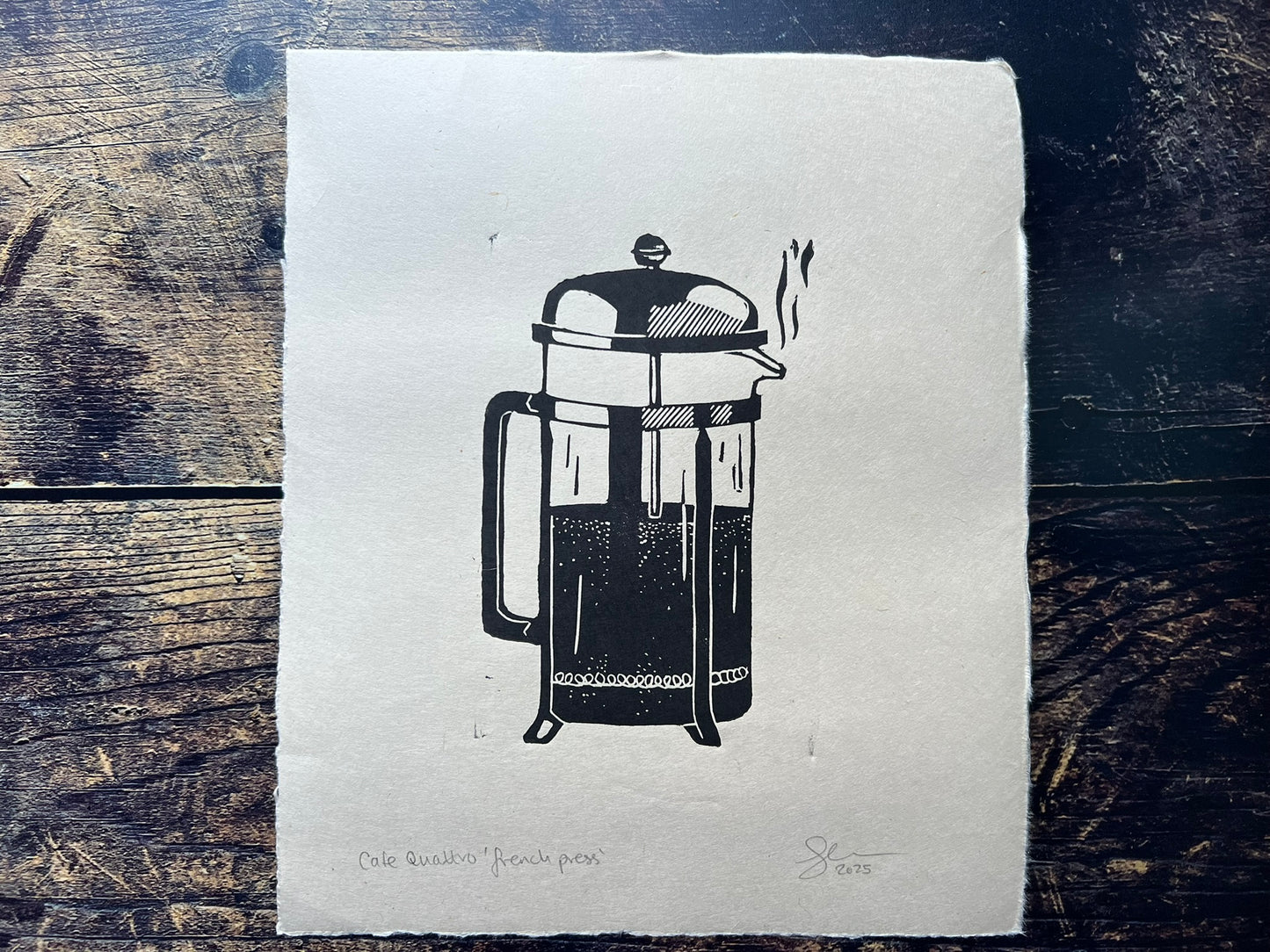 This is a small lino print of a french press