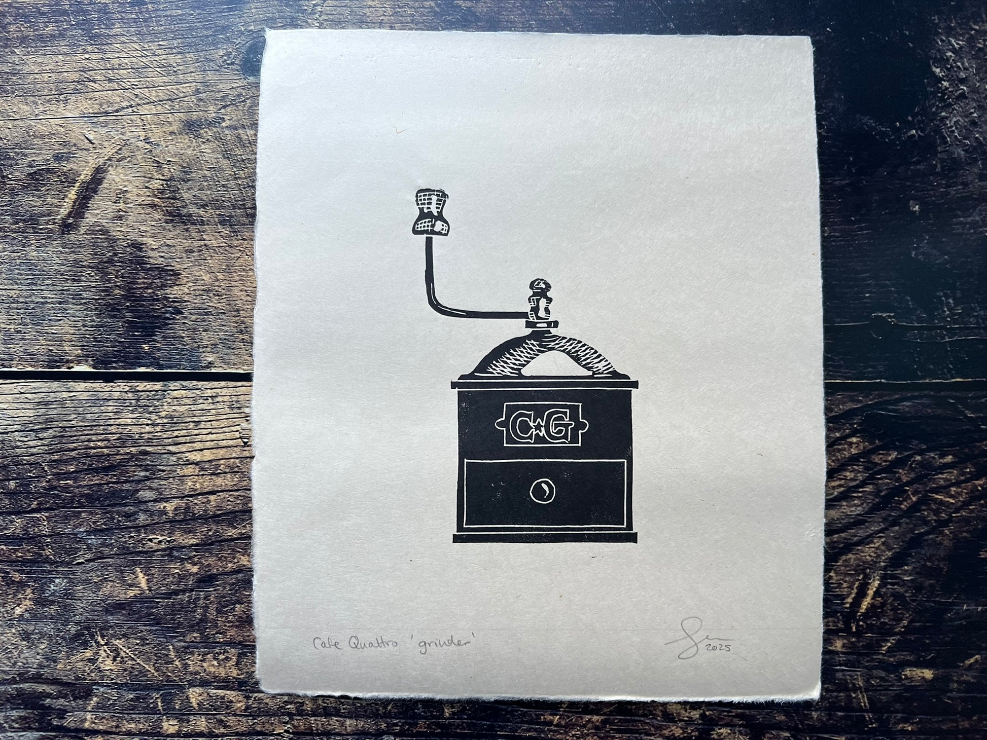 This is a small lino print of an antique coffee grinder