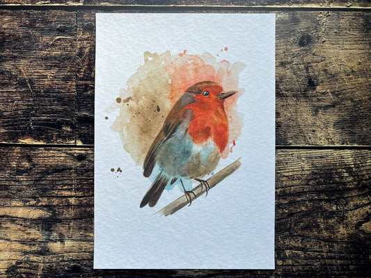 An A4 print of a robin on textured archival paper.