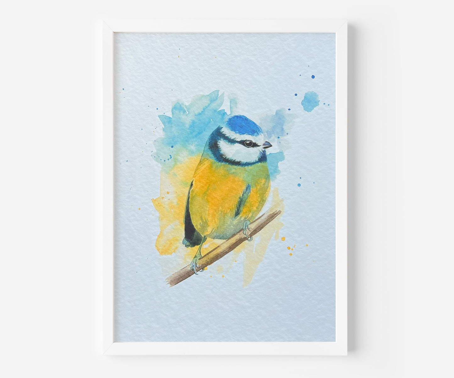 An A4 print of a blue tit on textured archival paper in a wooden frame.