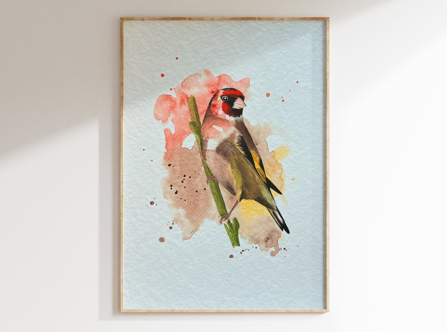 An A4 print of a goldfinch on textured archival paper.